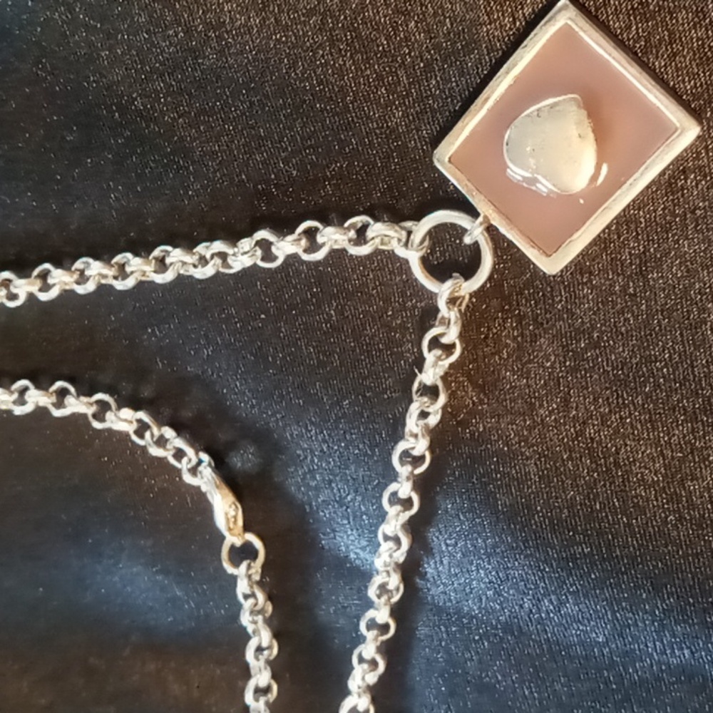 Stainless steel industrial heart necklace on a rollo stainless steel chain.